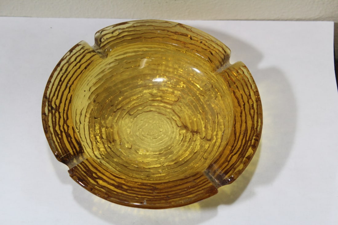 A Retro Amber Glass Ashtray: 6 1/4" in diameter - mid century modern texture style