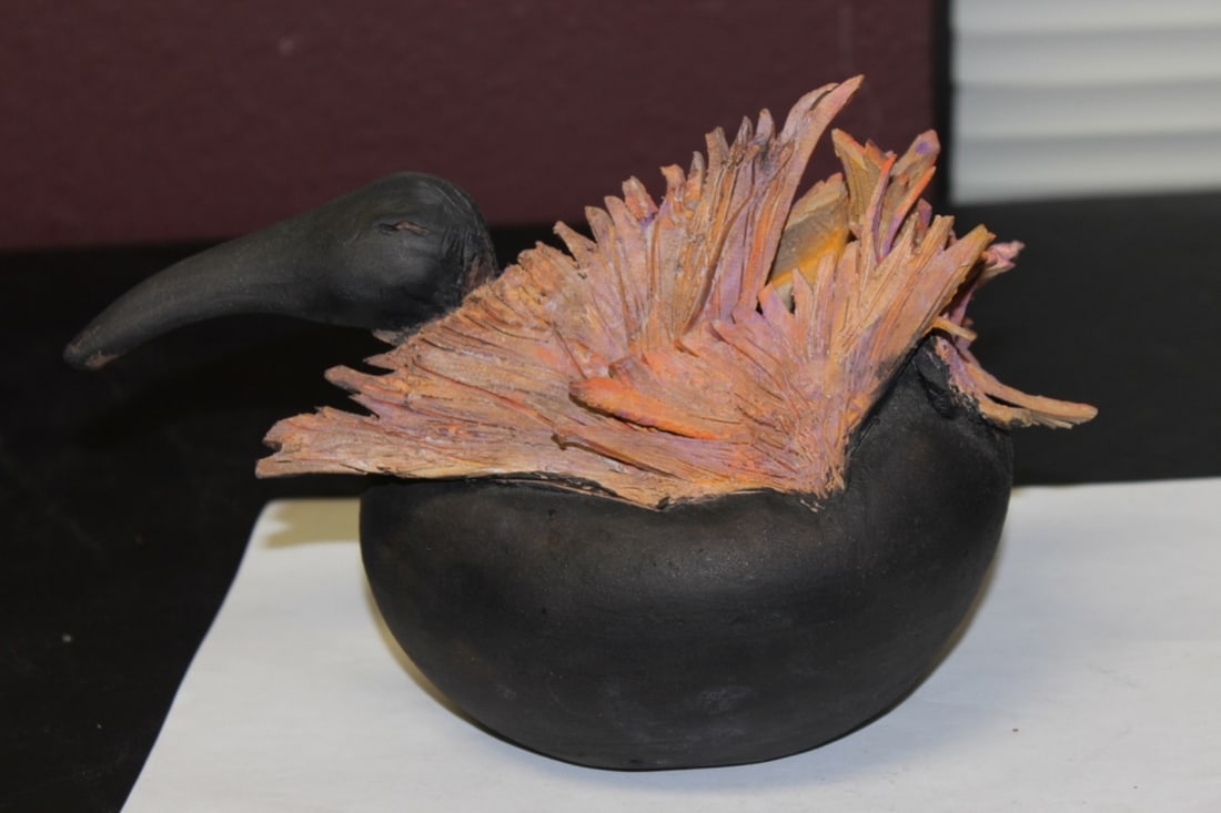 A Walter Yovaish Signed Bird: 9 1/2" long - please note: chip on one of the wings - still a very desirable piece