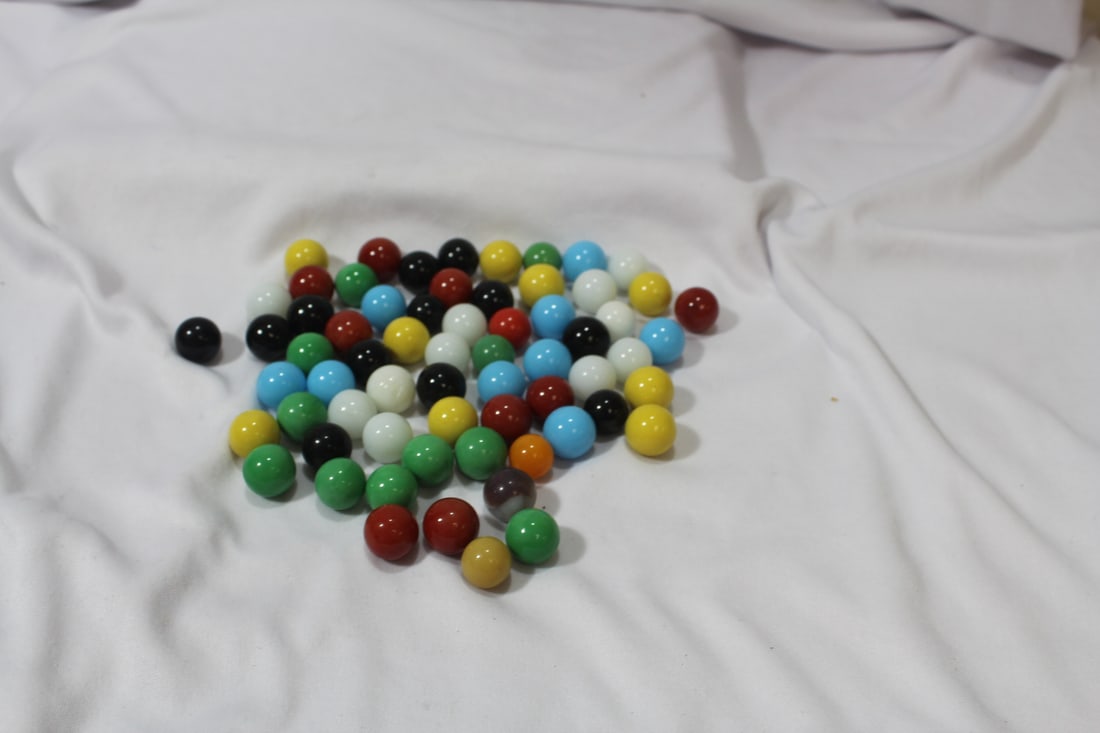 A Bag of 65 Marbles: As shown on photos