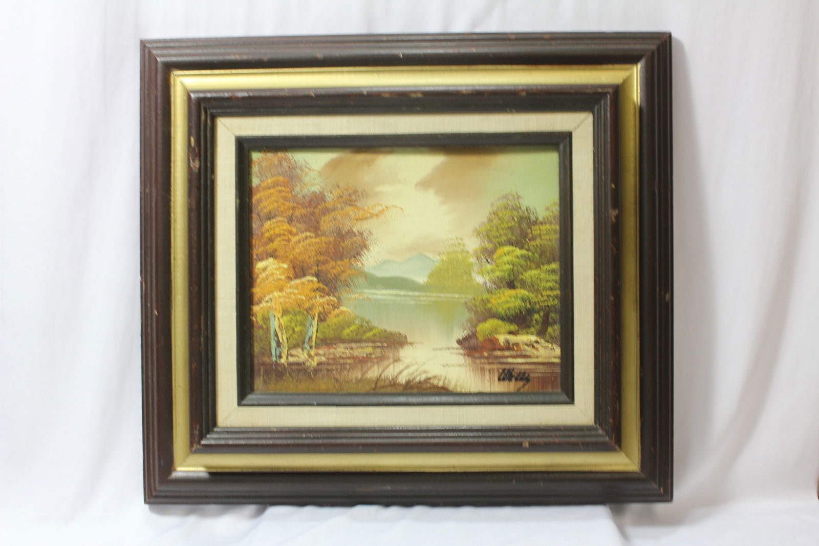 A Signed Oil On Board Painting: overall= 16 3/4" x 14 3/4"