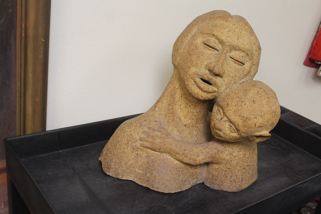 Signed J. Erickson Sculpture: Mother and child - possibly Diane Jean Erickson - approoximately 16"x 16" - material appeared to be cement