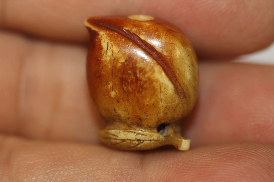 A Small Bone Bead: as shown