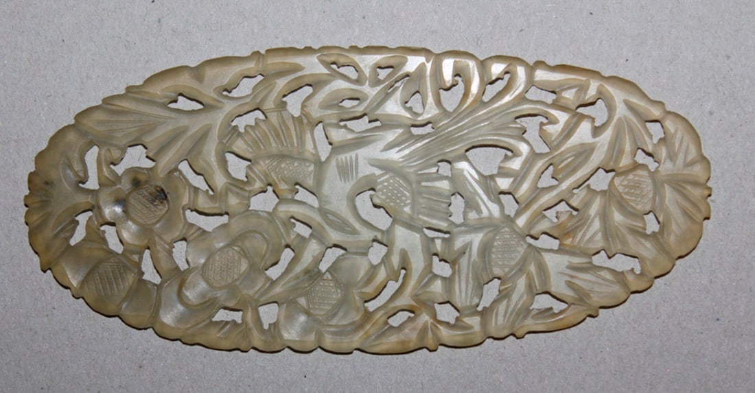 Oval Jade Plaque: Circa 20th century. 4 3/4" diameter.