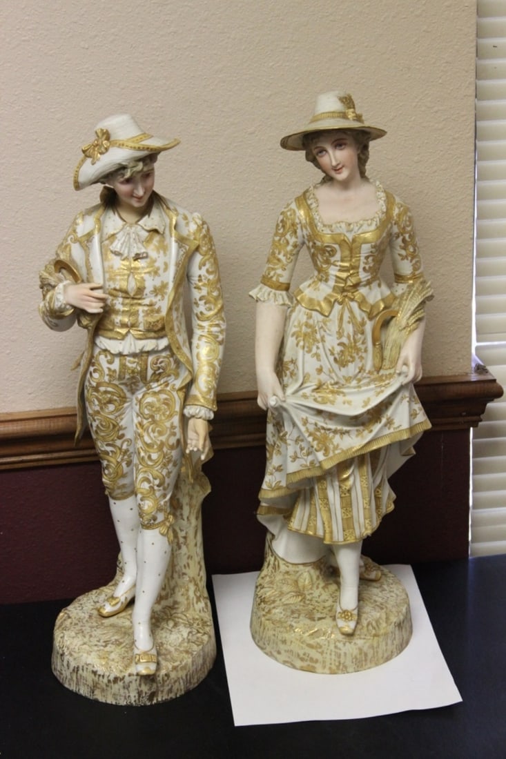 A Pair of German Figurine Boy and Girl: Most likely German - Boy and Girl or Man/Woman - Possibly old - Approximately 22 inches tall each