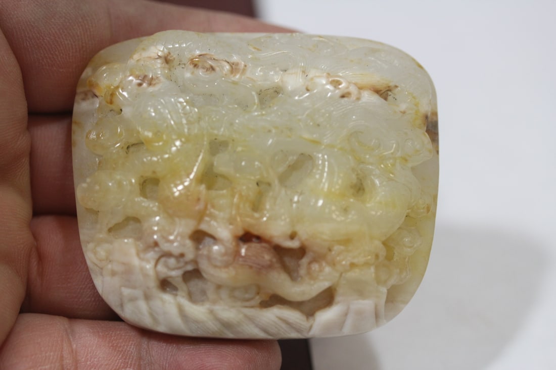 A Carved Jade Belt Buckle: 2 1/2" across - dragon motif