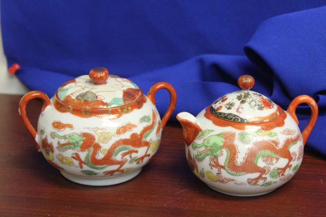 Set of Japanese Kutani Creamer and Sugar Container: dragon design - handle to handle = 4 1/2" in diameter - please note: one small chip on the lid as shown