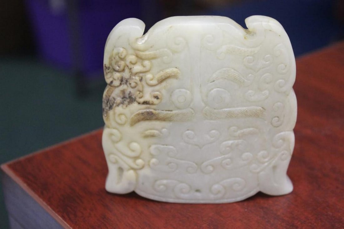 A Jade Plaque: good carving - 3 1/2" wide