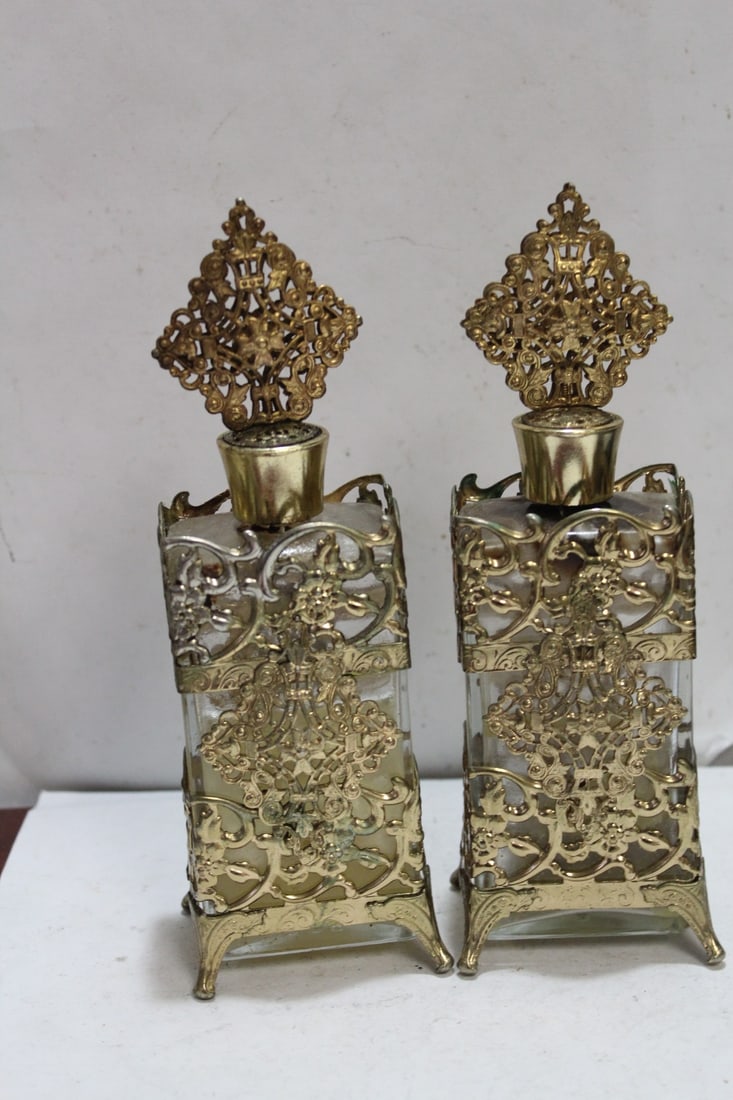 Lot of 2 Metal Gilted Parfume Bottles: still has parfume inside - please note: do not use parfume inside, as it may not be safe - 8 1/4" tall