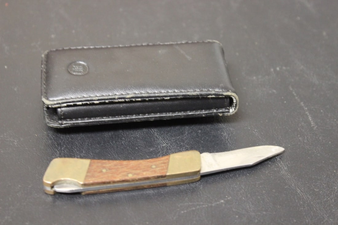 A Pocket Knife Inside a Leather Case: 3" long