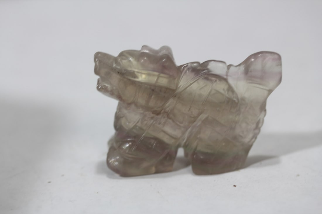 A Vintage Chinese Foo Dog: smokey quartz? Or rock crystal? - please note: small chip on the bottom of one leg - 2 inches across