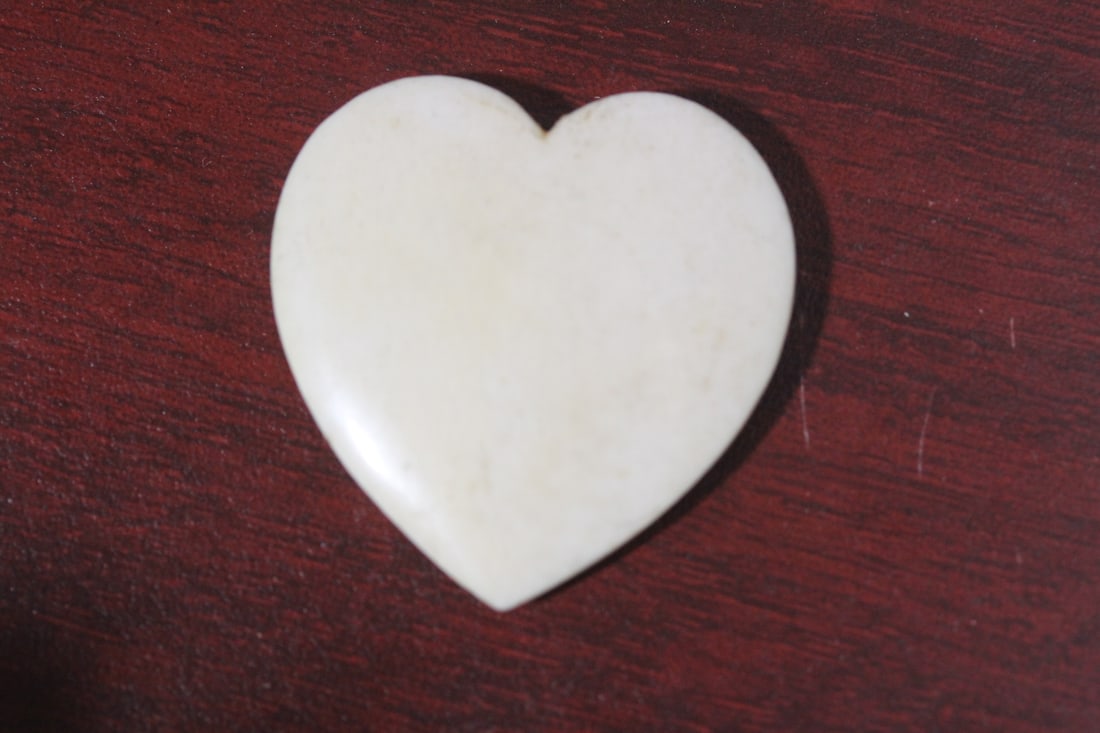 A Carved Bone Heart: as shown