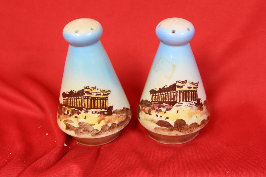 A Pair of Salt and Pepper Shaker: 3 3/4" tall