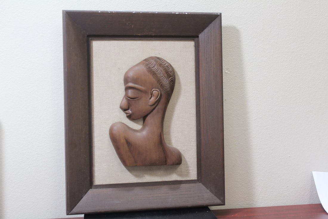 A Framed 3 Dimensional African Wooden Bust: overall= 13 1/4" x 16 1/2"