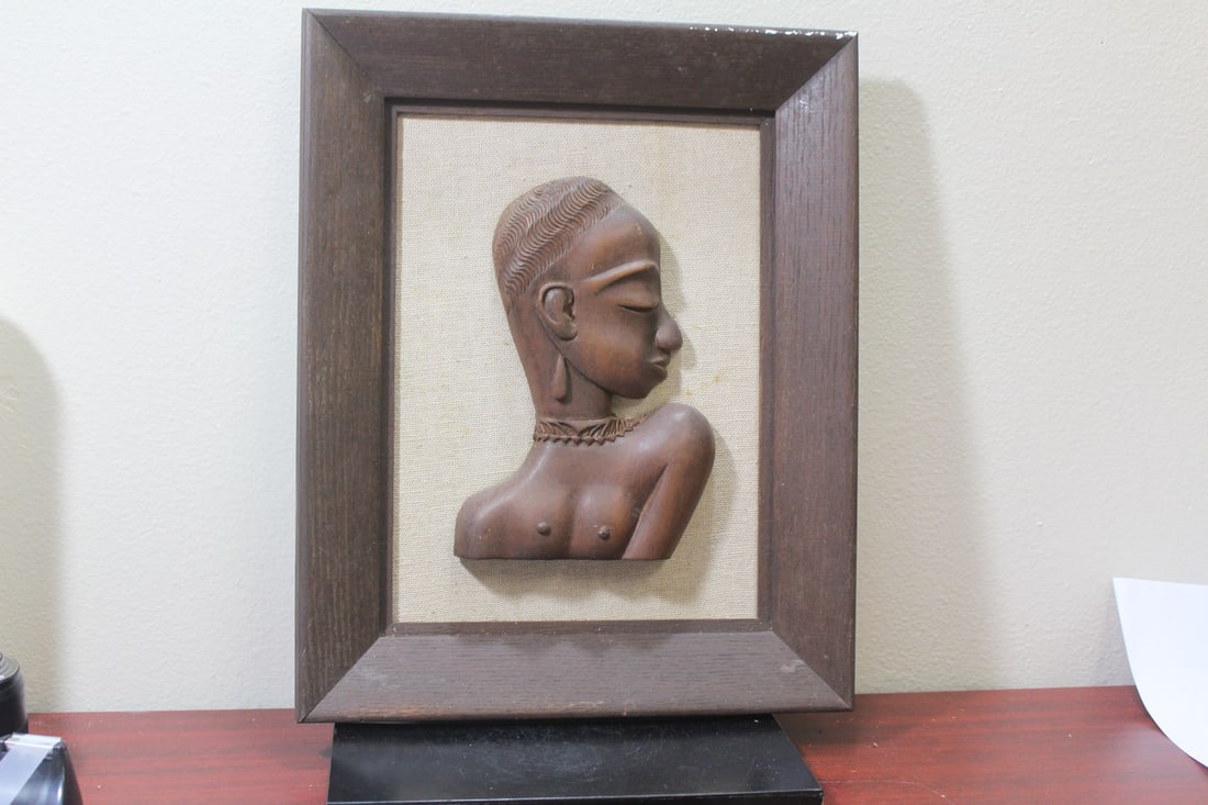 A Framed 3 Dimensional African Wooden Bust: overall= 13 1/4" x 16 1/2"