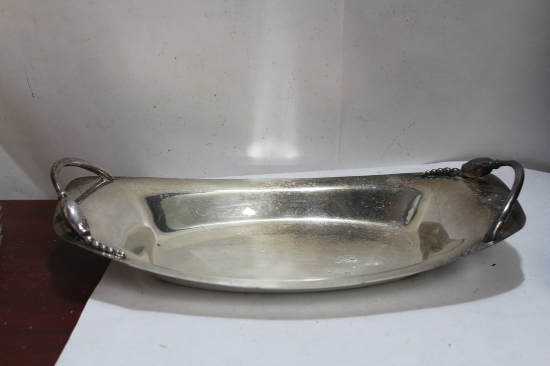 A Silverplated Tray: 12" across