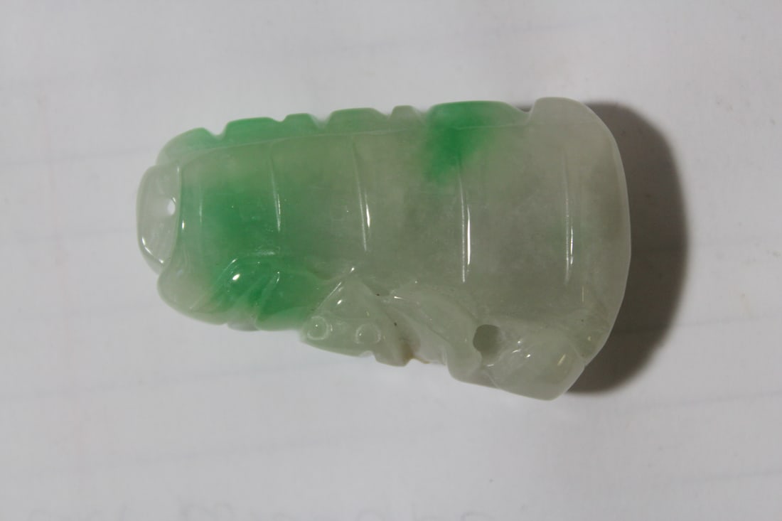 A Jadeite Pendant***: 2 1/8" in length