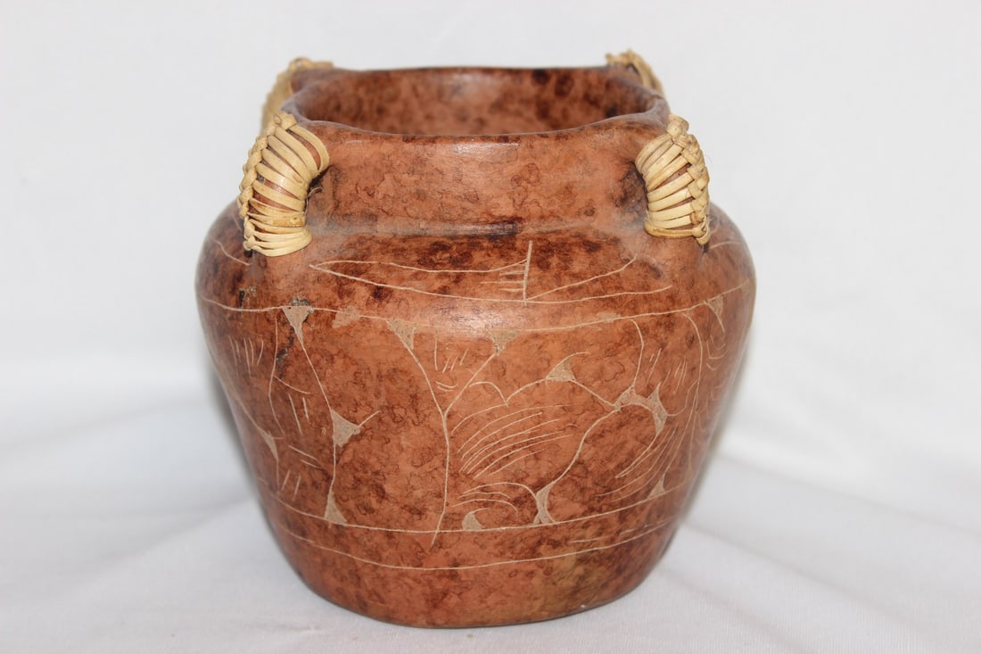 A Clay Etched Jar: 4" in diameter x 5 1/2" tall - please note: chipped as shown