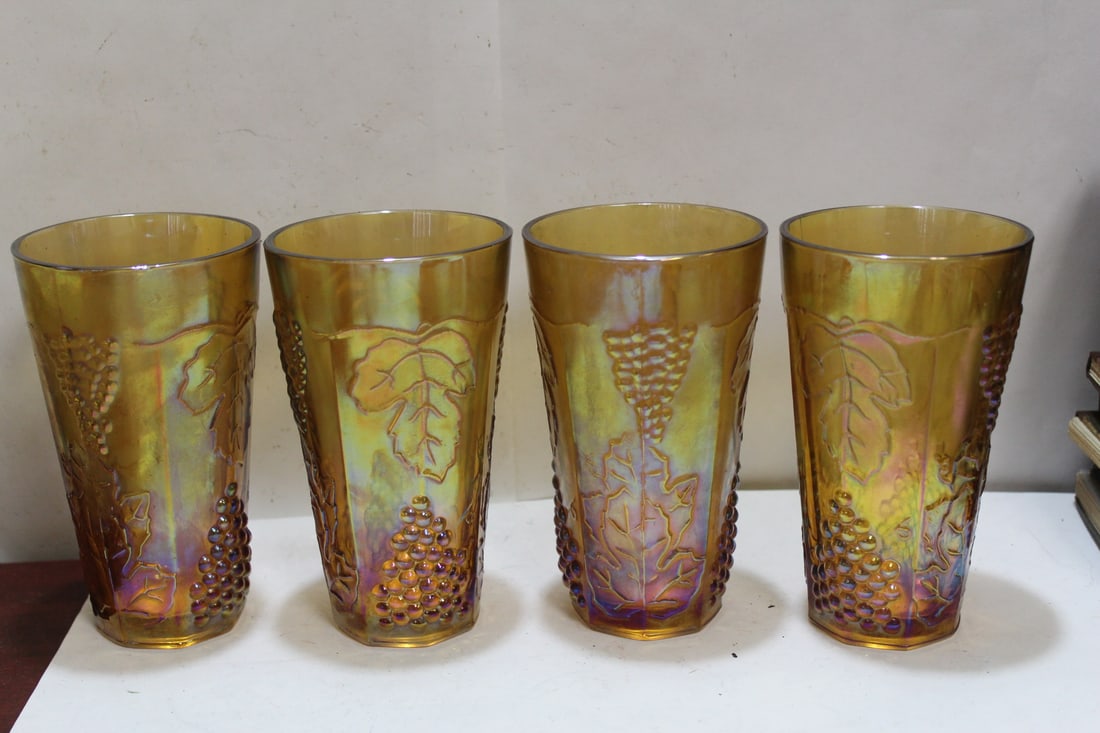 An Iridescent Carnival Glass Berry Cups: each measures 6 inches in height