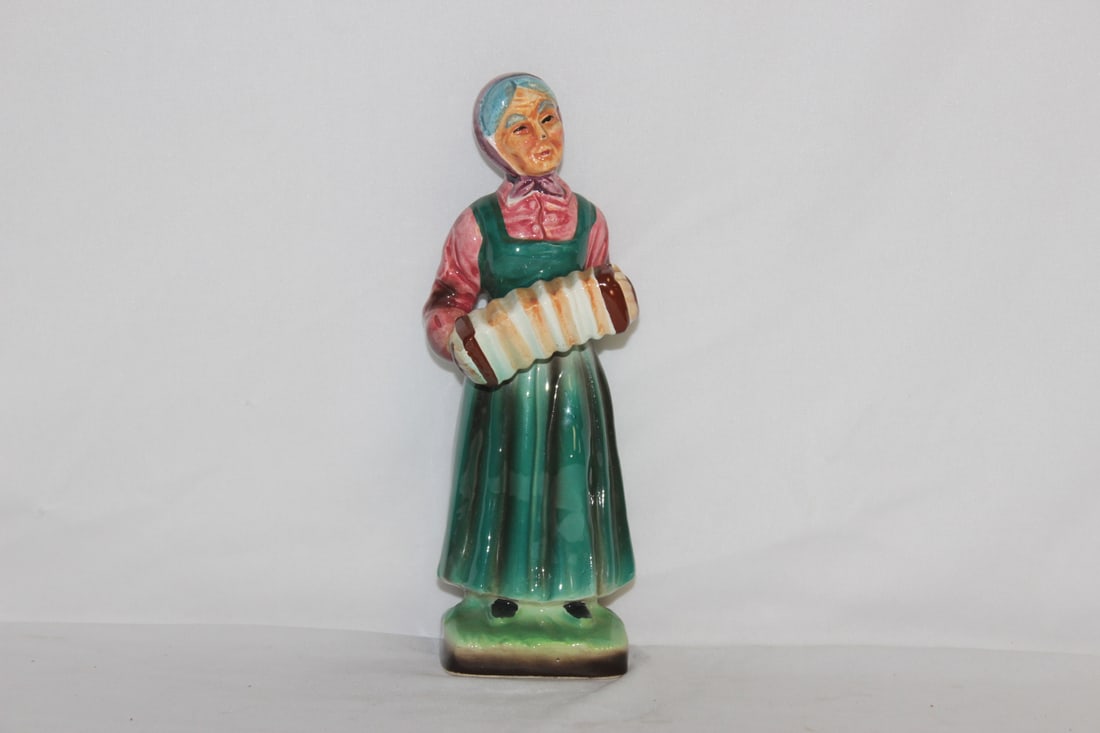 A Vintage Ceramic Figurine: 8 1/4" tall