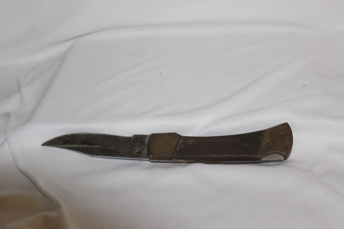 A Pocket Knife: 5" long