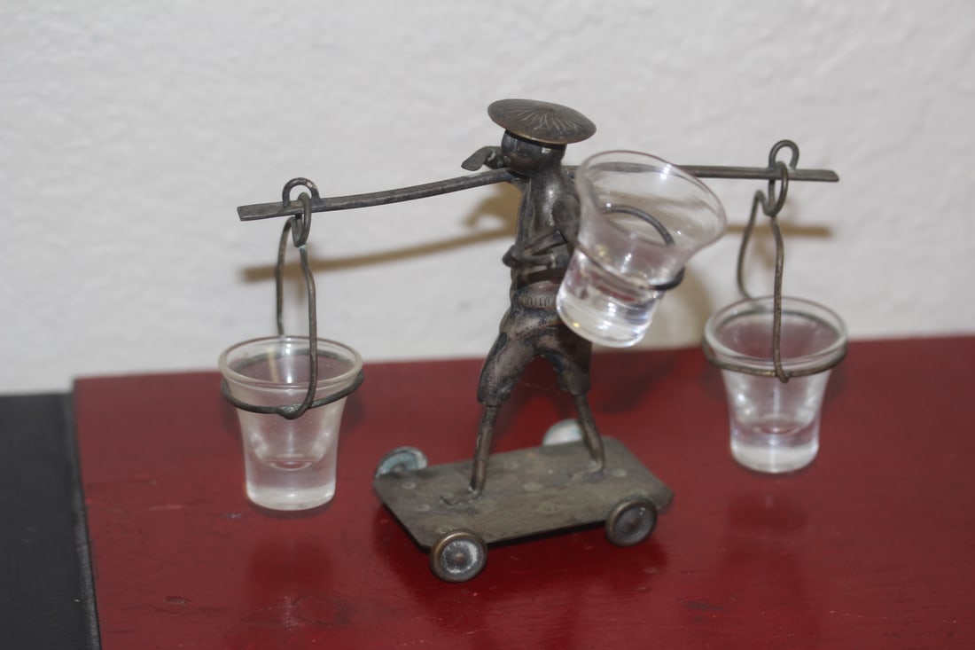 Silver or Silverplate Vintage Man on Wheels: wheels spin - 5 inches across