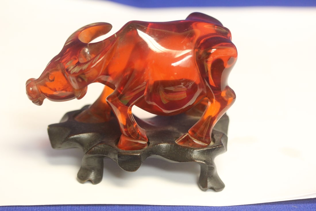 Vintage Chinese Cherry Amber Arcylic Bull: on stand - most likely 1930's - 4" across
