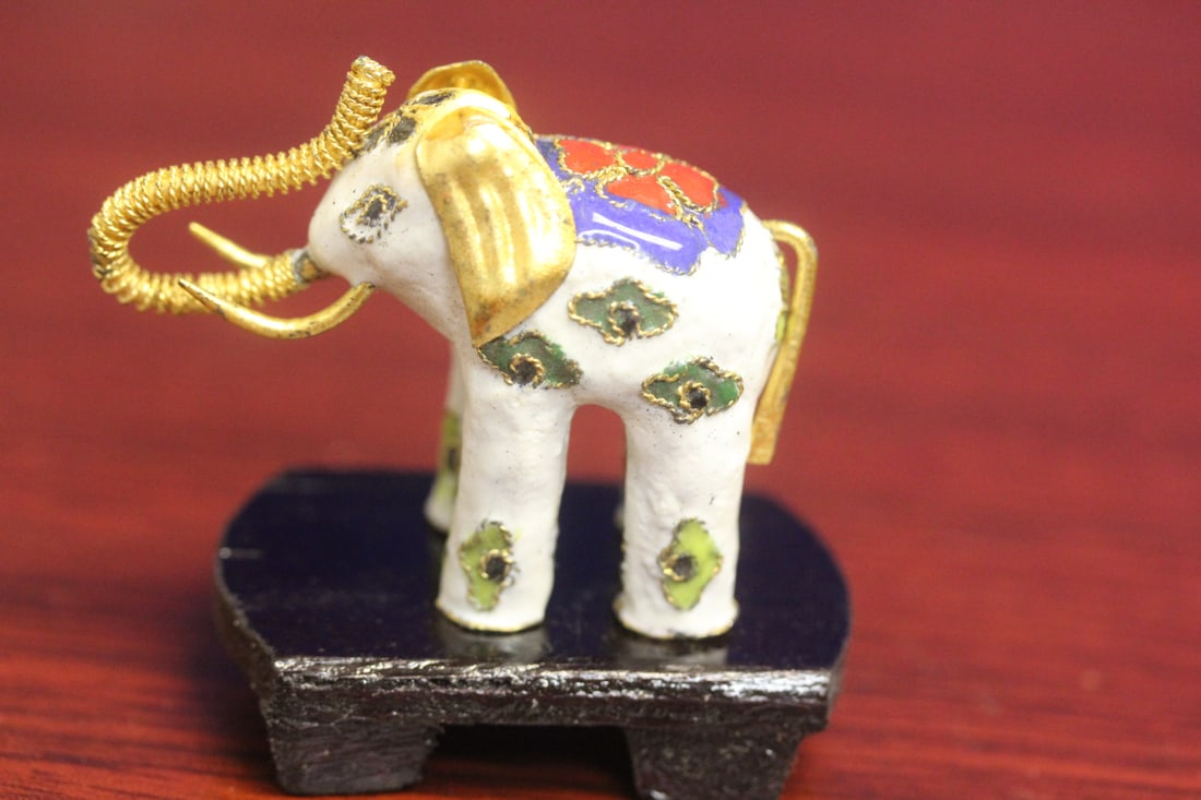 A Cloisonne Elephant on Stand: 2 inches across