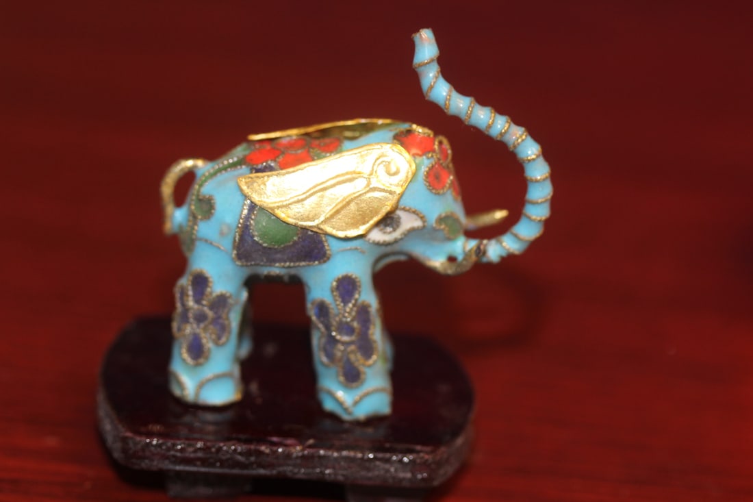 A Cloisonne Elephant on Stand: 2 inches across