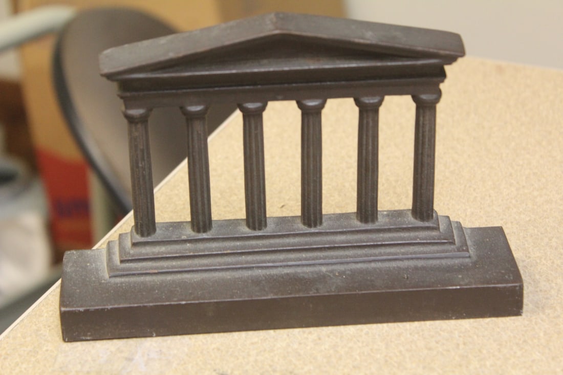 Heavy Door Stopper: bronze? - 7 inches across