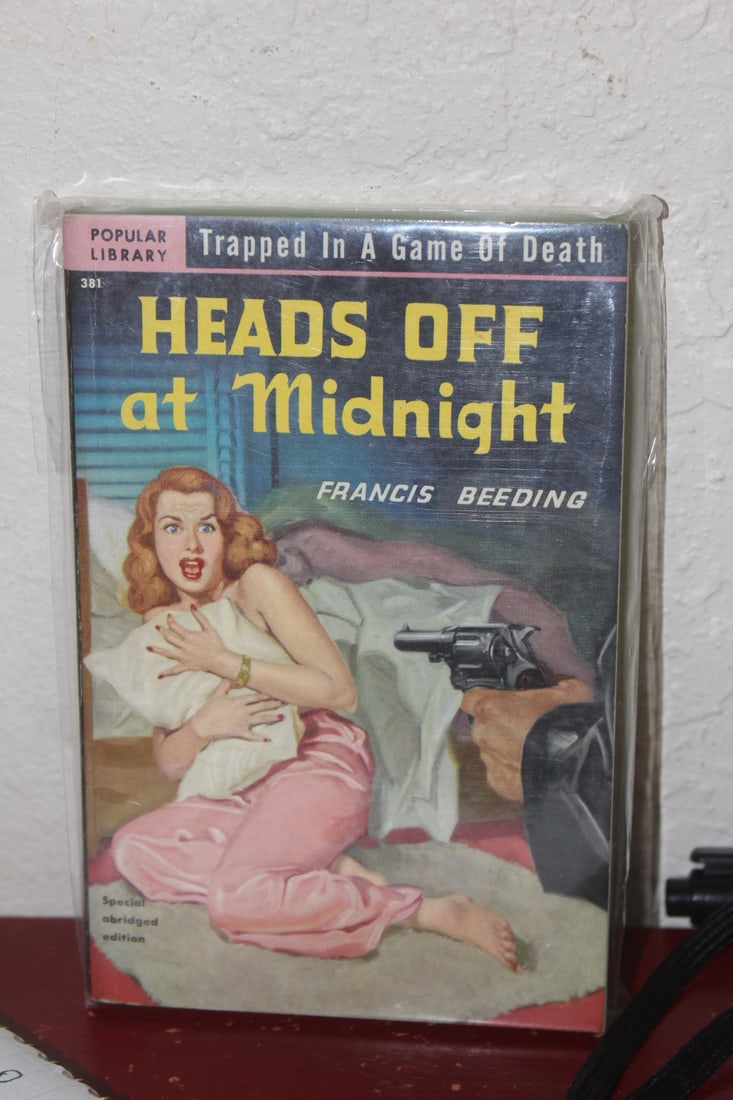 Paperback Novel: Heads off at Midnight: as shown on photos