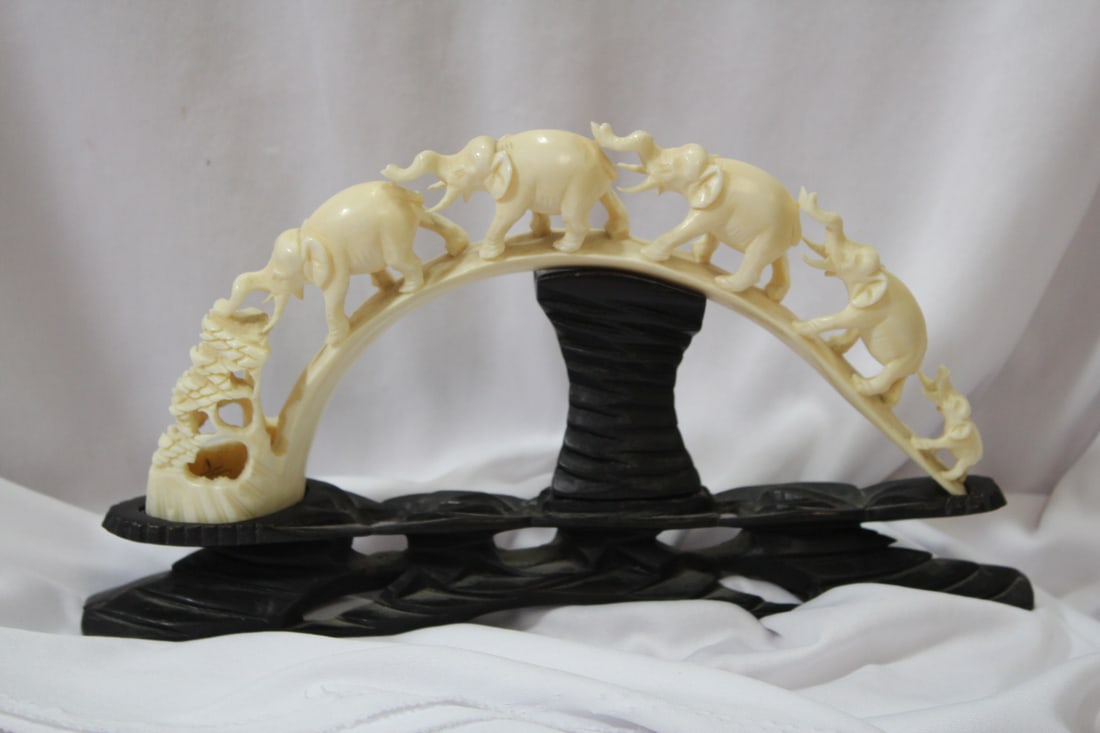A Carved Bone Trail of Elephants on Stand (1 of 10)