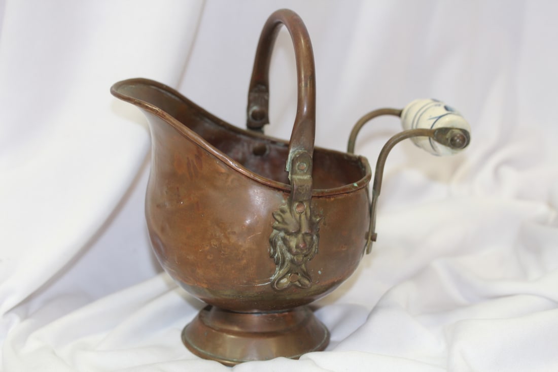 A Lion Motif Copper Container: possibly Delft handle - please note: minor dents due to age - overall= 6 7/8" tall