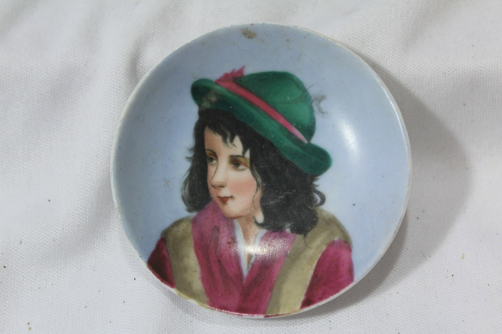 A Small Handpainted Portrail Dish: 2 3/4" in diameter