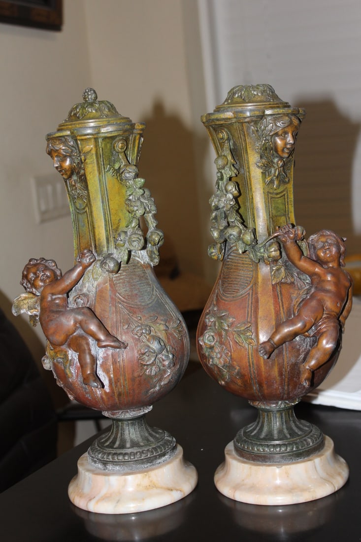 Pair of Metal Urns: marble base - early 20th century - please note: one finial broken off as shown - 15 inches tall