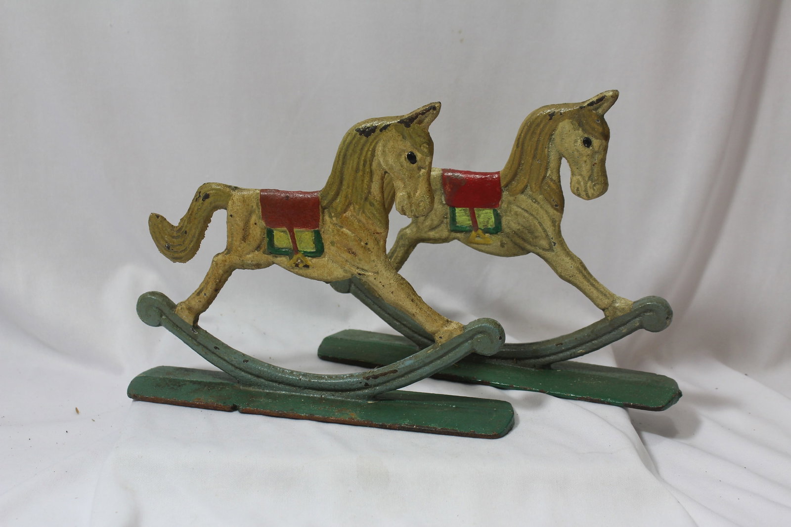 A Pair of Vintage Cast Iron Rocking Horses: 8 3/4" across- these are old, possibly mid 20th century or earlier