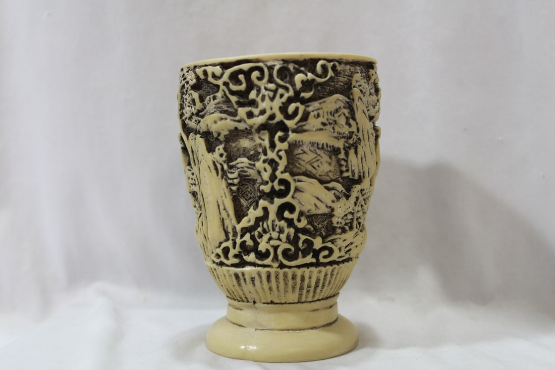A Carved Resin Cup: 5 1/8" tall