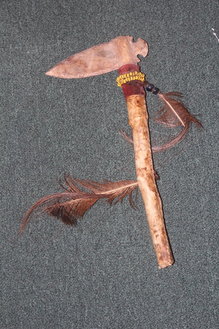 A Native American Stone Axe: with leather handle - not sure about the age, but it is well made - 17 1/4" long