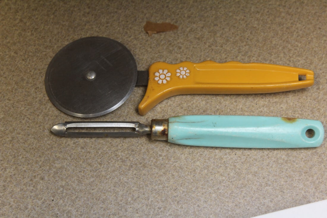 two retro era plastic handle untensils: as shown