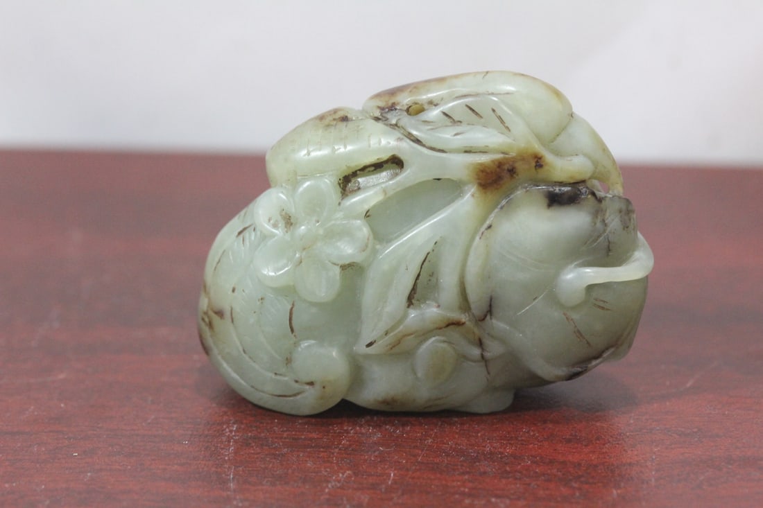 A Rousett Chinese Celadon Jade Phoenix: 2 3/4" across - please note: wire transfer only on this lot