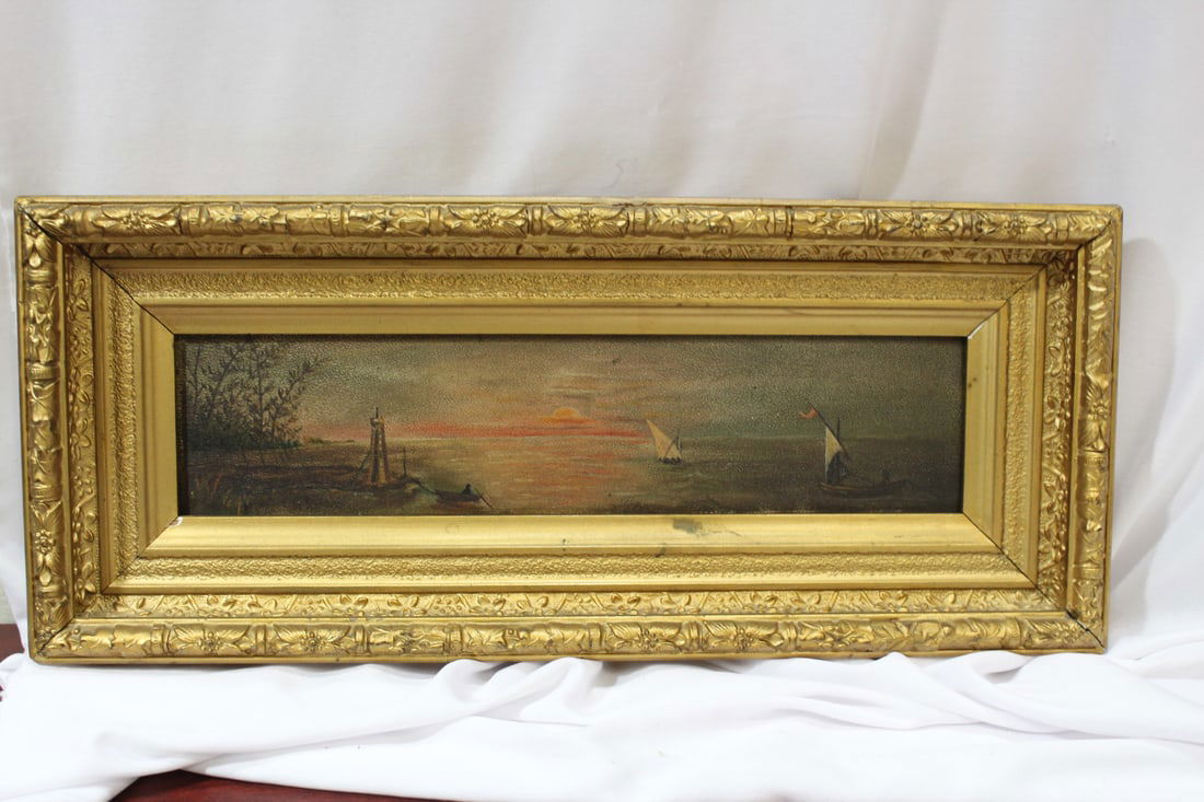 An Antique 19th Century Oil on Board: framed - overall= 17" x 7" - a beautiful sunset painting - nicely framed - appears to be unsigned