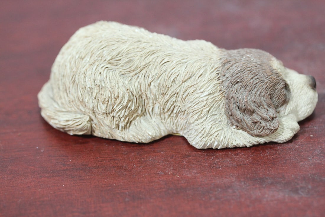 A Composite Material Sandicast Dog: signed and marked: Brue - 3 5/8" across