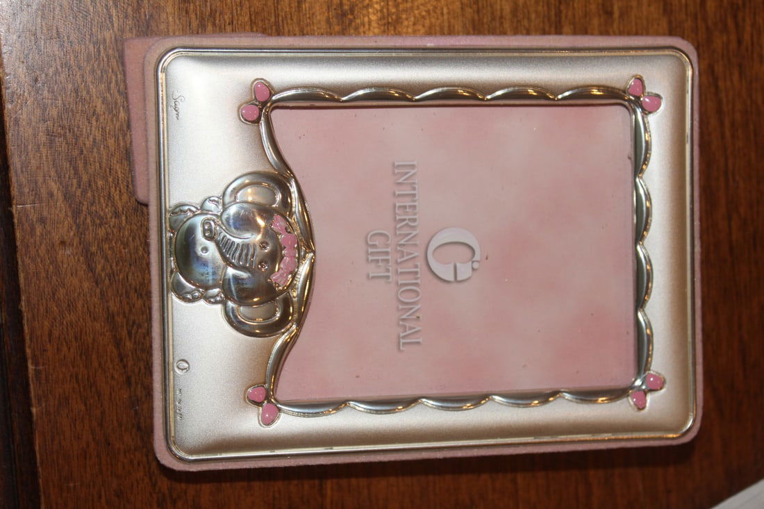 Sterling Photo Frame: marked: "Ag" (silver) - overall= 4 7/8" x 3 3/4" - will fit a 2 3/8" x 2 3/4" photo inside