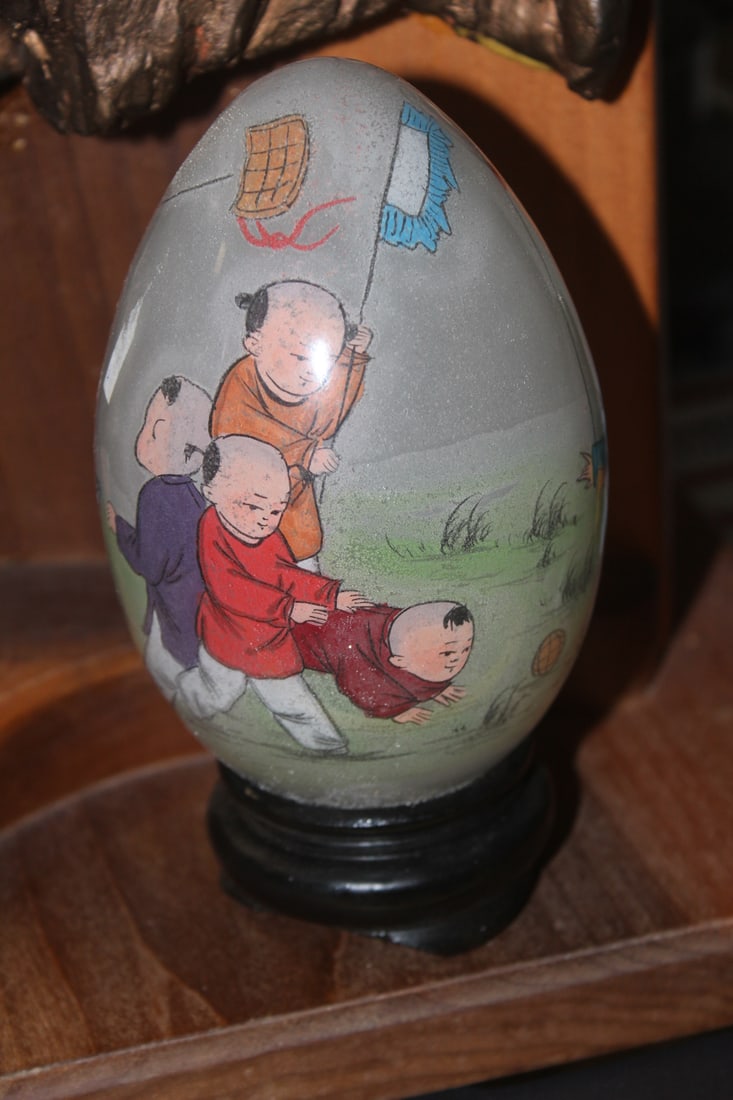 Reverse on Painting Glass Egg: children, on stand - overall= 6" tall