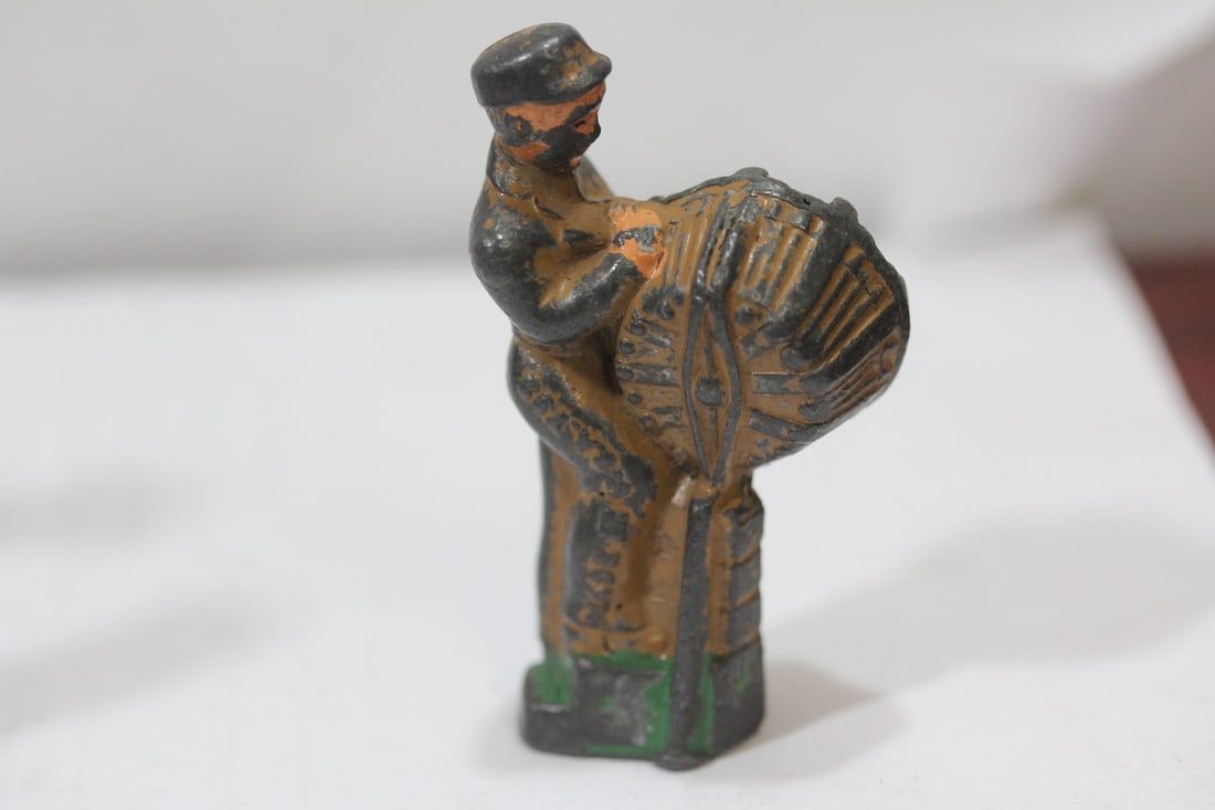 A Polychrome Worker Figurine: Early 20th century - 2 7/8" tall