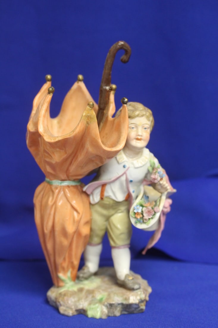 A Meissen Boy with Umbrella: possibly Meissen - please note: handle restored as shown - 8 1/2" tall