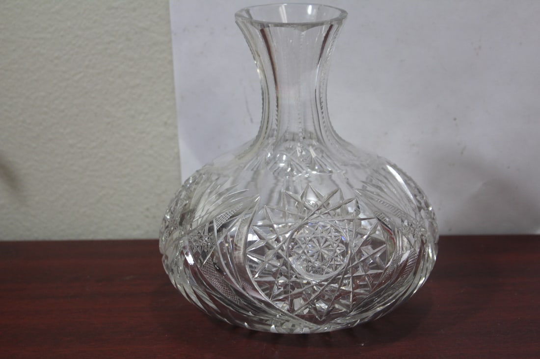 A Brilliant Cut Glass Bottle: please note: very tiny chip underneath, not noticeable when bottle is right side up - 7 inches tall