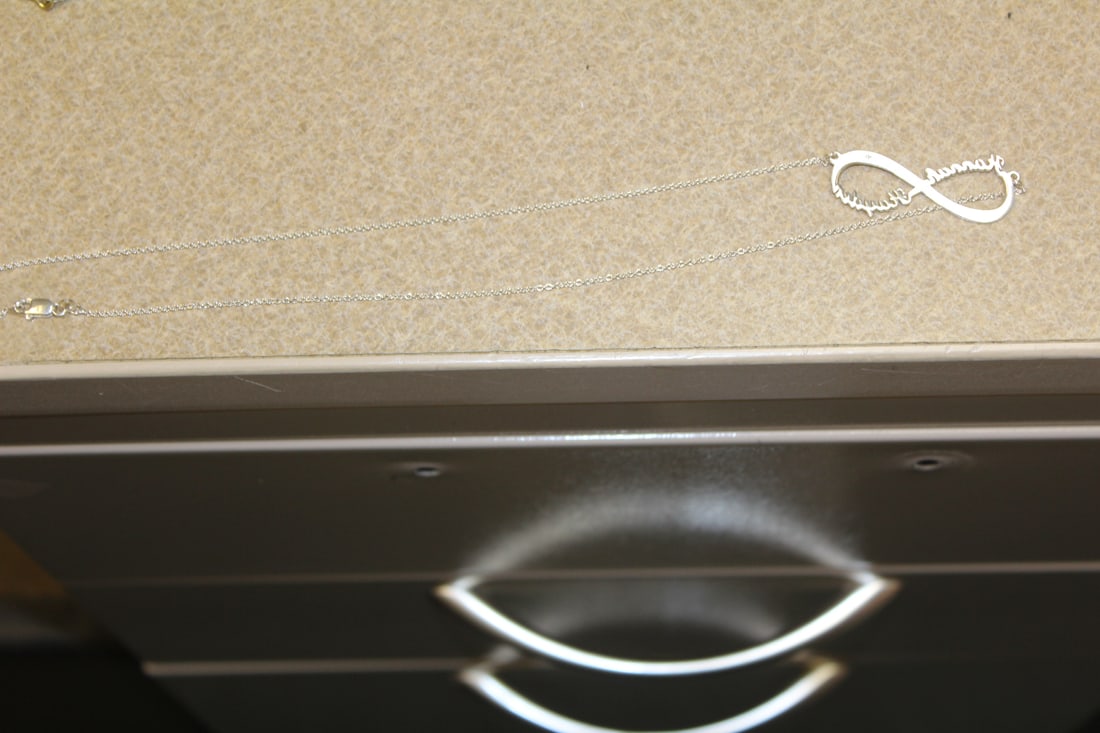 Sterling Necklace: marked Hannah - approximately 9" long when clapsed