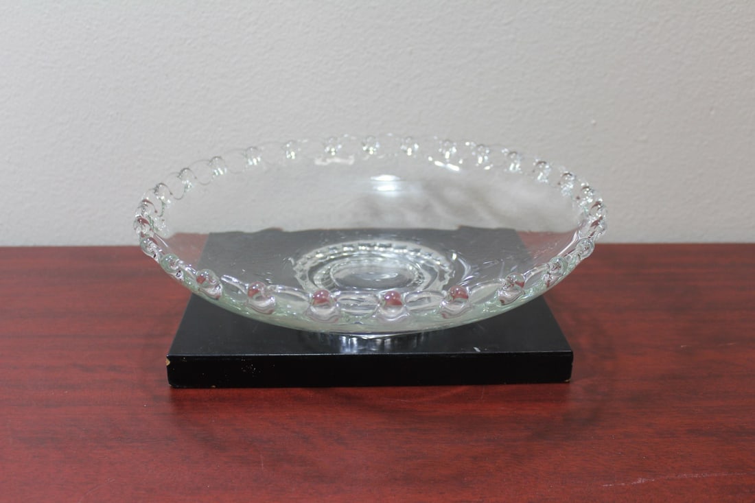 A Clear Glass Center Bowl: 12 1/2" in diameter - please note: chips on rim