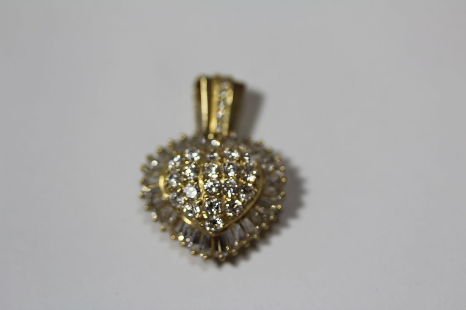 A 14KT Gold And Diamond Pendant: As shown