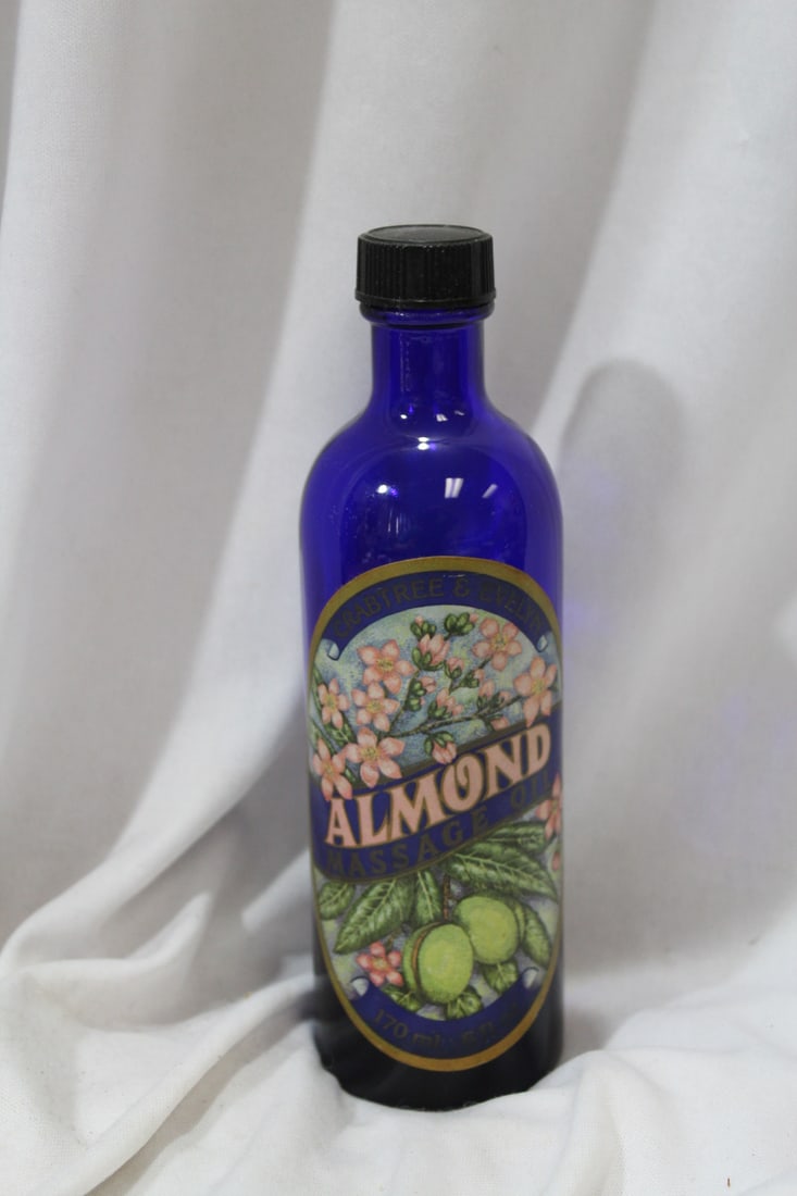 A Vintage Bottle Of Massage Oil: Crabtree and Evelyn Almond - half full